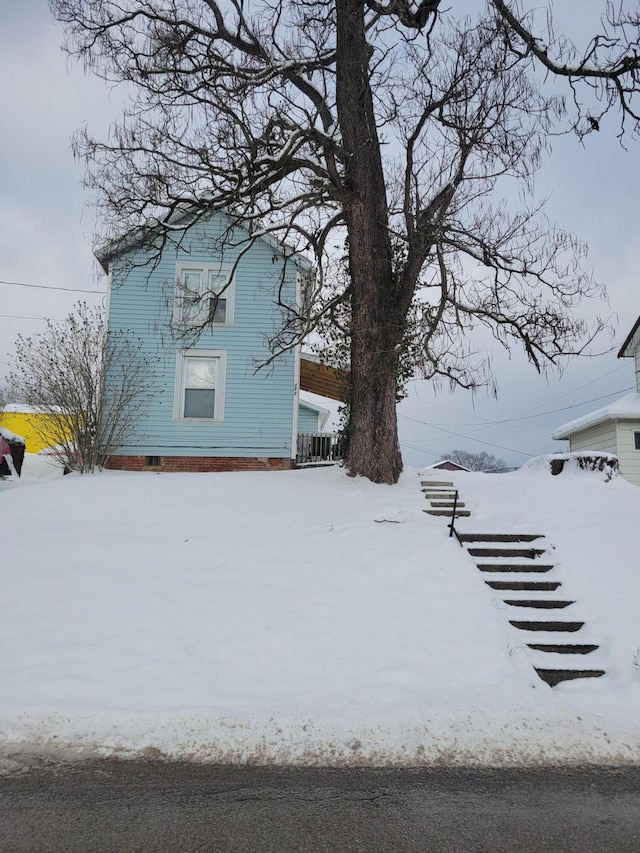 view of yard layered in snow