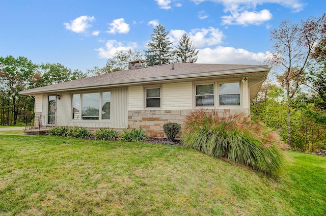 ranch-style house with a front lawn