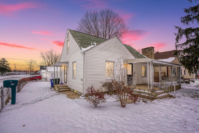 view of snow covered house