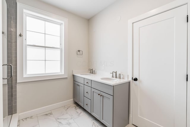 bathroom with vanity and a healthy amount of sunlight