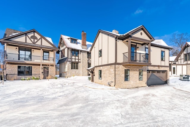 view of front of house with a balcony and a garage