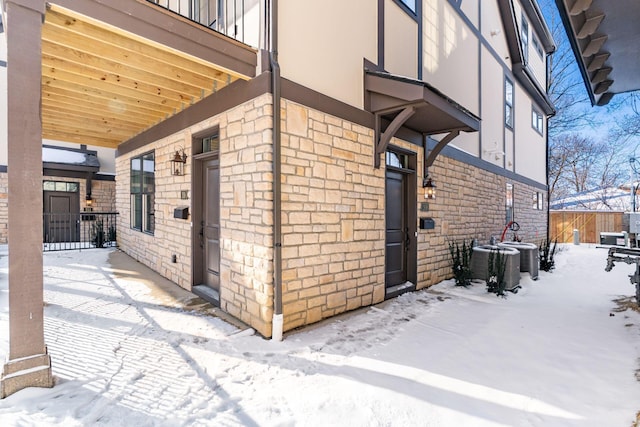 2015 W 5th Ave Unit 211, Columbus, OH 43212 - view of snowy exterior featuring central AC
