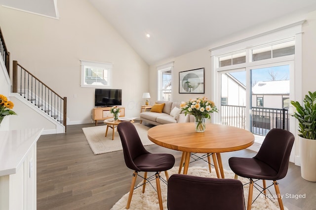 2015 W 5th Ave Unit 211, Columbus, OH 43212 - dining room featuring dark hardwood / wood-style floors and high vaulted ceiling