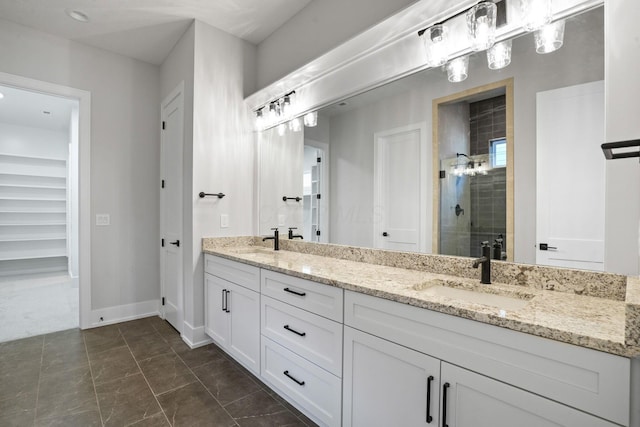 bathroom featuring walk in shower and vanity