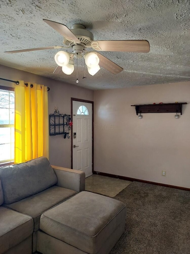 carpeted living room featuring a textured ceiling and ceiling fan