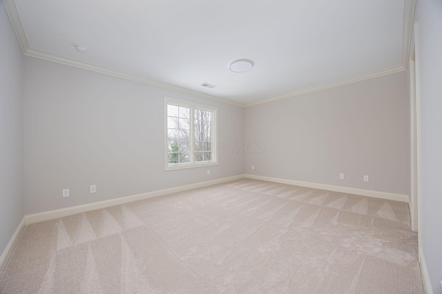 carpeted empty room with ornamental molding