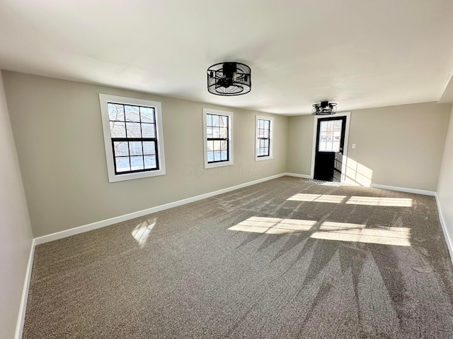 carpeted spare room with a wealth of natural light