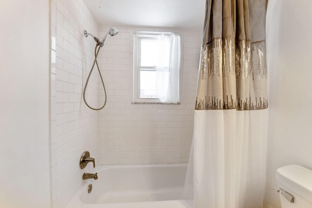 bathroom featuring toilet and shower / tub combo with curtain