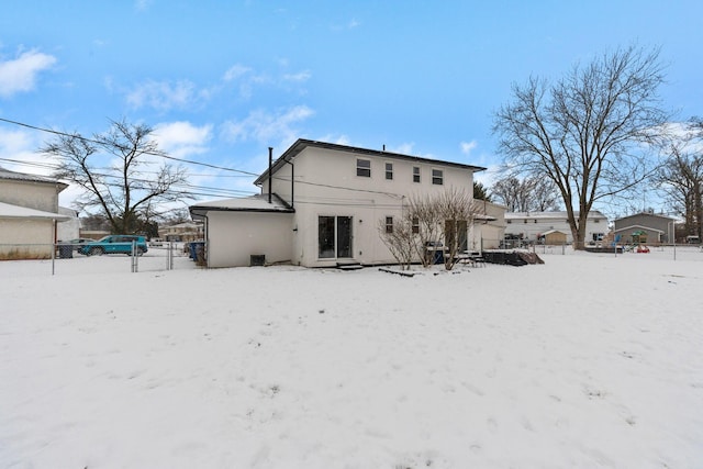 view of snow covered house