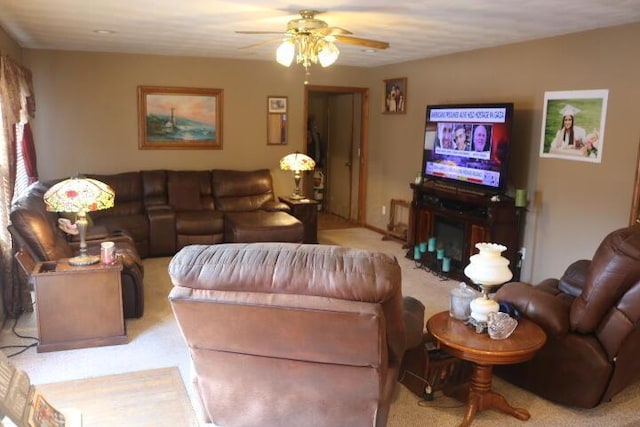 living room featuring light colored carpet and ceiling fan