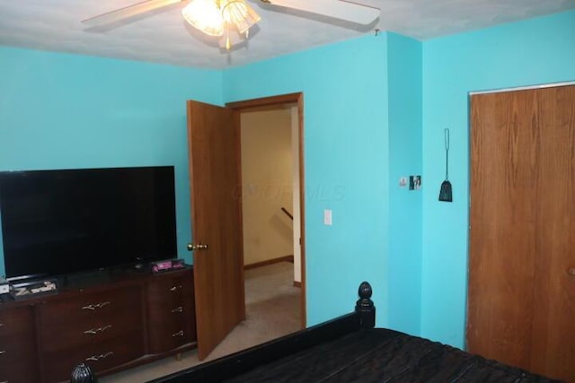 unfurnished bedroom with light colored carpet and ceiling fan