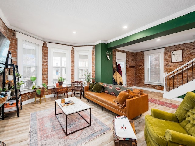 living room with wood-type flooring, brick wall, crown molding, and cooling unit