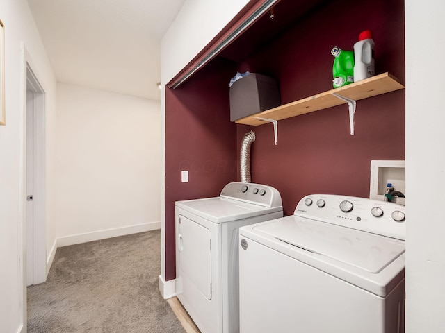 laundry room with separate washer and dryer and light colored carpet