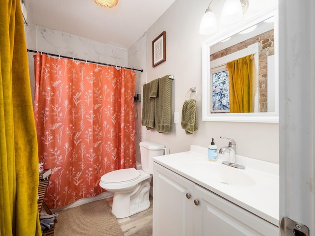 bathroom with vanity, toilet, curtained shower, and wood-type flooring