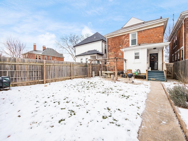 view of snow covered house