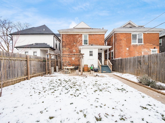 view of snow covered house