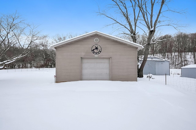 view of snow covered garage