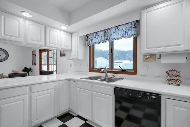 kitchen featuring white cabinets, dishwasher, and sink