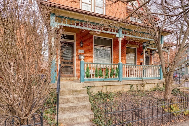 property entrance with covered porch