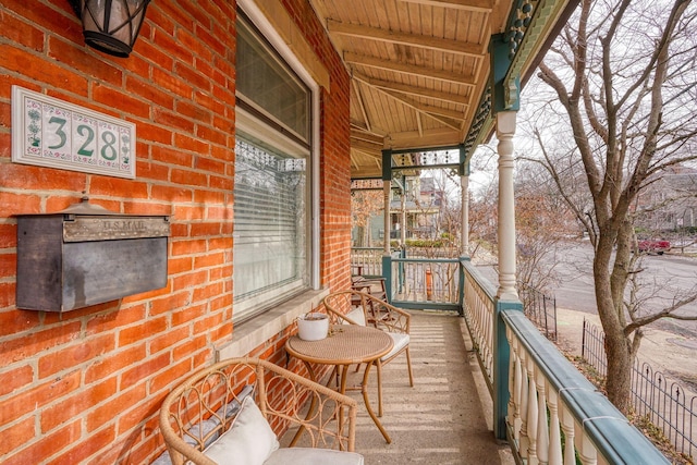 balcony featuring a porch