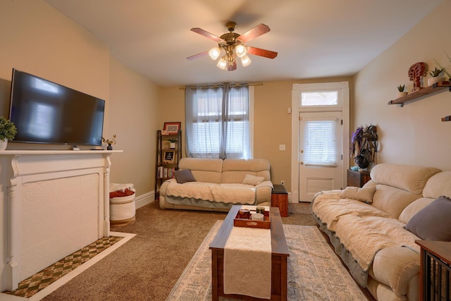 living room with light carpet and ceiling fan