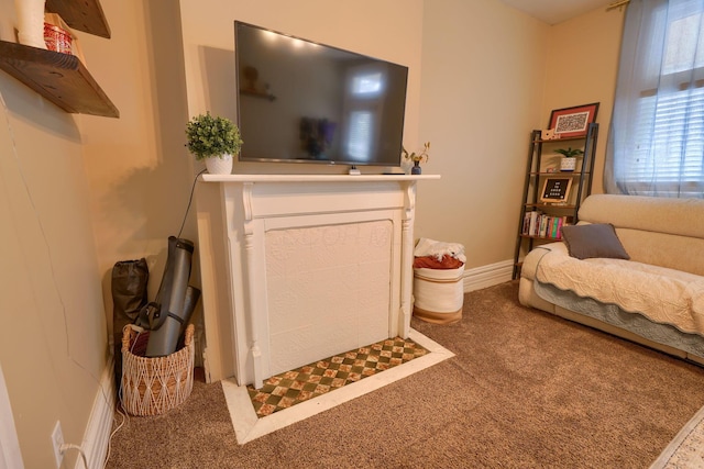 carpeted living room featuring a fireplace