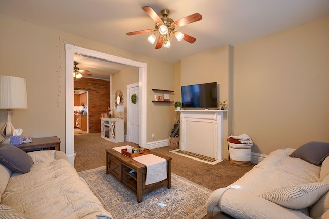 carpeted living room with ceiling fan