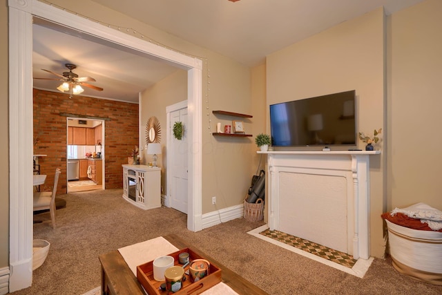 living room featuring carpet, ceiling fan, and brick wall