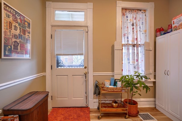 entryway with light hardwood / wood-style floors