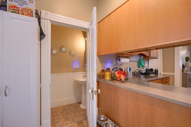 kitchen with sink and light tile patterned floors