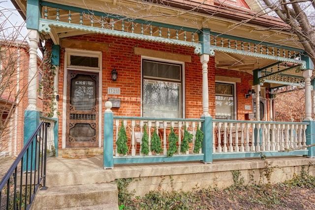 doorway to property featuring covered porch