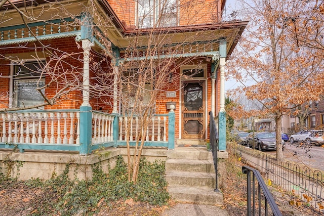 property entrance featuring covered porch