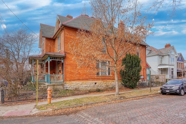 view of side of home with a porch