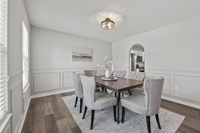 dining area featuring dark wood-type flooring