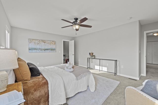 bedroom featuring ceiling fan and light colored carpet