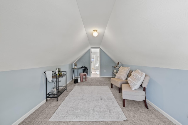 living area with carpet floors and lofted ceiling