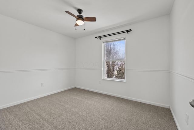 spare room with ceiling fan and carpet floors