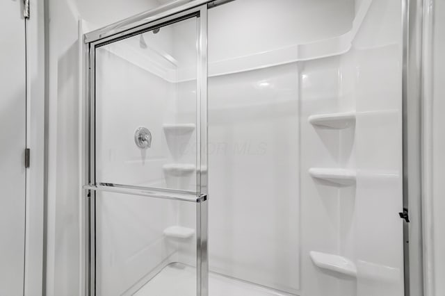 bathroom featuring a shower stall