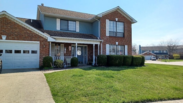 view of property with a garage, covered porch, and a front yard