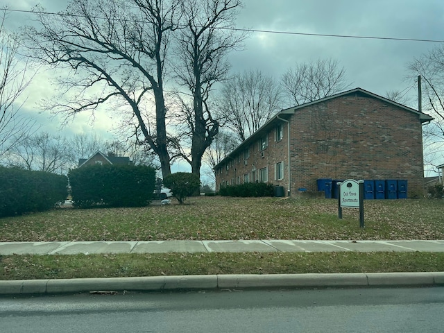 view of home's exterior with a yard