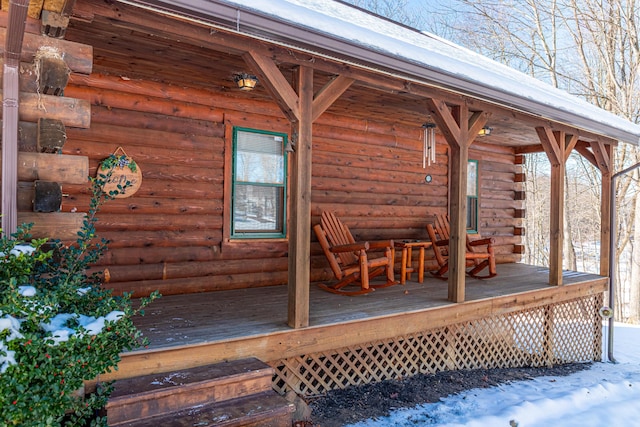 view of snow covered deck