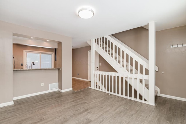 interior space with hardwood / wood-style floors