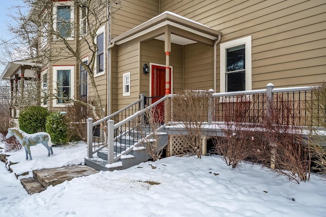 view of snow covered property entrance