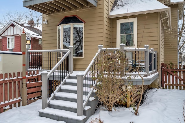 view of snow covered property entrance