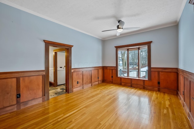 unfurnished room featuring ceiling fan, crown molding, a textured ceiling, and light hardwood / wood-style flooring