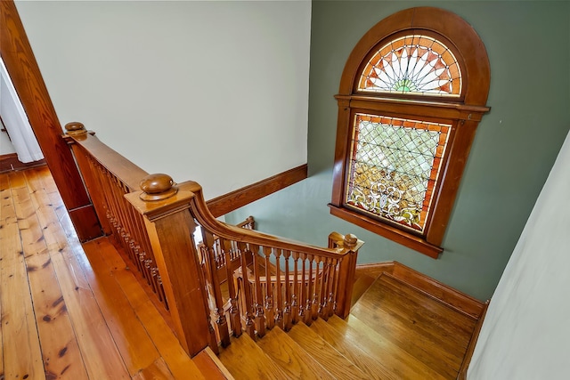 staircase featuring hardwood / wood-style flooring