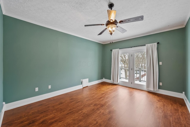 spare room featuring hardwood / wood-style floors, ceiling fan, crown molding, and a textured ceiling