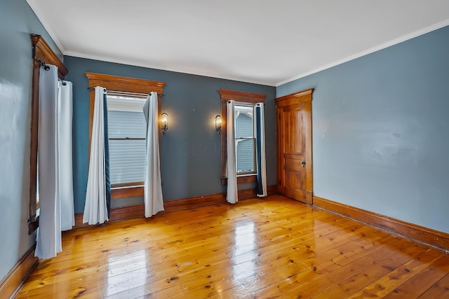 unfurnished bedroom with light hardwood / wood-style floors and ornamental molding