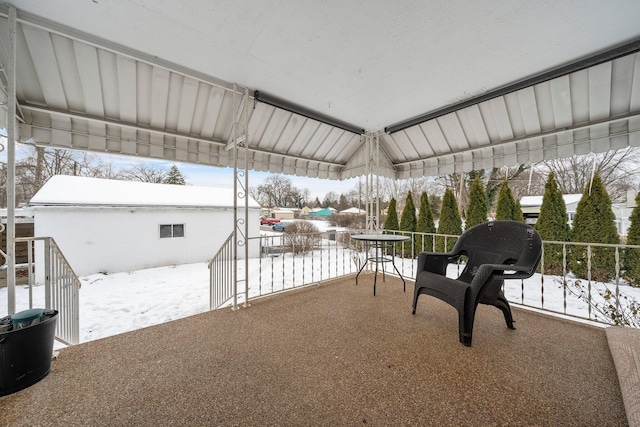 view of snow covered patio