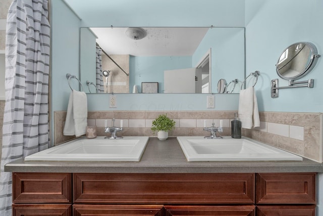 bathroom featuring vanity and decorative backsplash